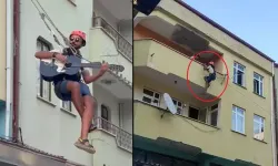 Eşyalarını taşıdığı halatın üzerinde gitar çaldı